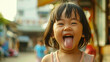 happy asian girl sticking tongue out