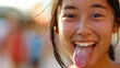 happy asian woman sticking tongue out