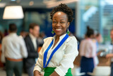 Fototapeta  - Vibrant Professional at Corporate Event. Joyful African American woman with a badge at a business conference.