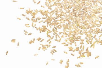 Wall Mural - Long brown rice, uncooked and hulled, isolated on white, top view