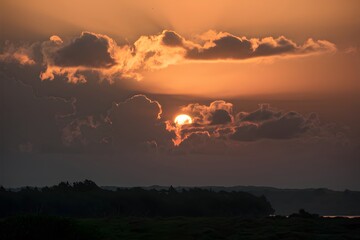 Sticker - Sun peeks through clouds, creating a captivating visual spectacle