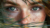 Fototapeta Sport - Portrait of a woman with freckles on tree branches. Generative AI