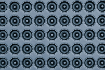 Aufkleber - A blue background of many circles of various sizes. The circles are all different sizes and are arranged in a pattern. The photo has a somewhat abstract and minimalist feel to it
