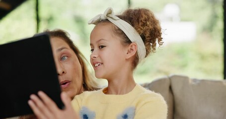 Wall Mural - Girl, granny or tablet as gaming, app or technology as online, learning or fun on sofa in home. Elderly woman or child at touch screen to play, browse or read in elearning, bonding or together