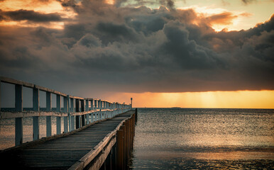 Wall Mural - The view of the ocean and Sorrento Long Pier under the sunbeam in Mornington Peninsula in Melbourne at dawn 