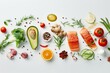 Salmon and avocado among fresh food ingredients - Fresh salmon filets with avocado and vegetables emphasizing healthy diet