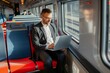 businessman working on a laptop on an intercity train