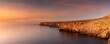 cliffs and rugged shorelina at Pont d'en Gil in northeastern Menorca near Ciutadella just after sunset