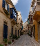 Fototapeta  - idyllic picturesque city street in downtown Birgu in the Three Cities of Valletta