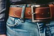 leather belt on a mans waist with jeans