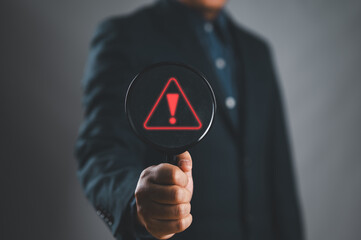 Poster - Businessman using laptop showing warning triangle and exclamation sign icon Warning of dangerous problems server error