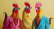 © Maxim - Surreal fashion concept. Three chickens dressed in colorful suits and sunglasses against a yellow background, evoking a quirky and playful mood.