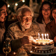Grandfather grandpa birthday party family concept celebration. One old man enjoy group of people in front of a birthday cake with candles. Age celebrate. Elderly lifestyle. Retirement. Holiday night