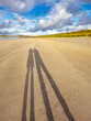 Shadow of couple enjoying the beach