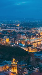 Canvas Print - Tbilisi, Georgia 4k Timelapse. City During Sunset And Night Illuminations. Elevated Top View Of Famous Landmarks In Night Illuminations. Beautiful Heaven. Cityscape From Midday To Night. Scenic View