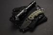 Everyday carry EDC items for men in black color - flashlight, tactical gloves and knife. Survival set. Minimal concept
