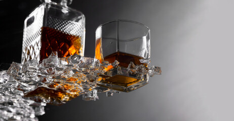 Wall Mural - Whiskey with ice on a glass table .