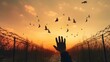 Silhouette refugee hands raising with birds flying and barbed wire on autumn sunset background, AI-generated