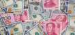Chinese Yuan bills  vs  U.S. dollar as background .