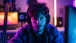 © Erzsbet - Gamer streamer youtuber or twich streamer young man teenager boy in rgb colored light
