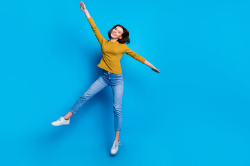 Wall Mural - full length photo of cheerful cute lady dressed shirt jumping high rising hands arms empty space iso