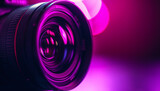 Fototapeta Natura - black camera lens in purple neon purple background