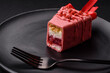 Delicious sweet cheesecake with fruits covered with icing with a wooden stick