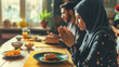 Spiritual Moment of Muslim Couple Engaged in Prayer Before Mealtime