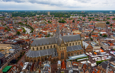 Wall Mural - Haarlem, Netherlands. Church of Saint Bavo. Panorama of the city in summer in cloudy weather. Aerial view