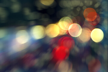 Wall Mural - blurry background image of defocused colorful abstract city street lights at night