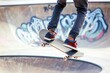 skateboarder performing a trick at an urban skate park