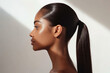© Татьяна Евдокимова - Side profile of a woman's elegant sleek ponytail under soft lighting