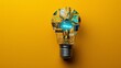 a circuit-printed light bulb symbolizing innovation and technology on a vivid yellow background, blending digital computing with business creativity