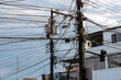 complex network of electrical wires on an urban pole