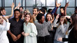 © Katsiaryna - Supporters clapping at political gathering in the office