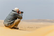 A colleague photographer photographing certain aspects of the desert
