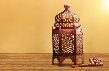 Wall Mural - Golden metal arabic lantern on the desk