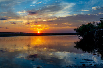 Wall Mural - Evening sky reflection on river water