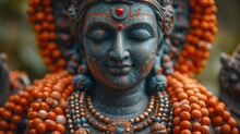   A Close-up Of A Woman Statue Wearing Orange Beads And A Necklace