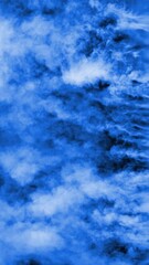 Wall Mural - vertical flowing blue fog streams 4k loop features streams of blue fog or steam flowing in from the 