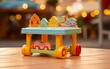 A colorful toy table with a toy train chugging along its tracks