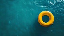 Yellow Swimming Pool Ring Float In Blue Water. Concept Color Summer.