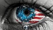 a closeup of an eye painted with the American flag's red, white, and blue colors. One eyelid is wet with tears.