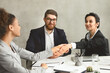 © Prostock-studio - Business handshake at meeting