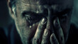 A close-up depicts a distressed man, his hands held to his face, overwhelmed by emotional turmoil and profound sadness.