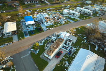 Poster - Badly damaged mobile homes after hurricane Ian in Florida residential area. Consequences of natural disaster