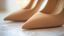 Beige Stiletto Shoes From Suede Background