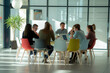 © ASDF - group of businesspeople sitting around a round table