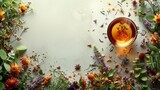 Fototapeta  - A digital creation of a picture frame composed of a hot cup of herbal tea surrounded by an assortment of dried herbs and flowers, against a white backdrop. The rising steam