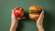 © jaz_online - apple and burger in hands